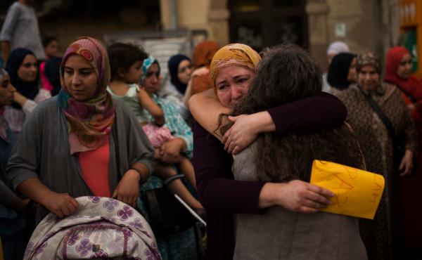 Members of the local Muslim community gather along with relatives of young men believed responsible for the attacks in Barcelona and Cambrils to denounce terrorism in Ripoll, Spain, on Aug. 20. Members of the local Muslim community gather along with relatives of young men believed responsible for the attacks in Barcelona and Cambrils to denounce terrorism in Ripoll, Spain, on Aug. 20.