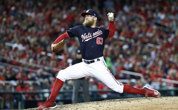 Sean Doolittle of the Washington Nationals delivers the pitch against the Houston Astros during the seventh inning in Game 5 of the 2019 World Series at Nationals Park on Oct. 27. Sean Doolittle of the Washington Nationals delivers the pitch against the Houston Astros during the seventh inning in Game 5 of the 2019 World Series at Nationals Park on Oct. 27.