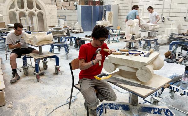 Students chip and chisel away at heavy slabs of stone in the workshops of the Hector Guimard high school, less than three miles from Paris' Notre Dame cathedral. Students chip and chisel away at heavy slabs of stone in the workshops of the Hector Guimard high school, less than three miles from Paris' Notre Dame cathedral.