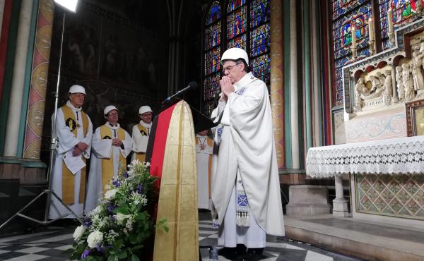 A small group in hard hats gathered on Saturday for Mass in Paris' Notre Dame cathedral. It was the first Mass since a fire devastated the church in April. A small group in hard hats gathered on Saturday for Mass in Paris' Notre Dame cathedral. It was the first Mass since a fire devastated the church in April.