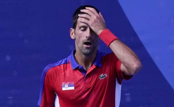 Novak Djokovic of Serbia reacts during the bronze medal match that he lost to Spain's Pablo Carreño Busta at the Tokyo Olympics on Saturday. Novak Djokovic of Serbia reacts during the bronze medal match that he lost to Spain's Pablo Carreño Busta at the Tokyo Olympics on Saturday.