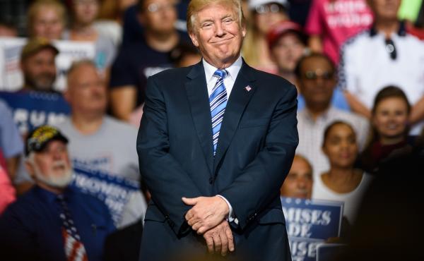 Speaking to a crowd in Huntington, W.Va., on Thursday, President Trump said the U.S. economy is on its way back. Speaking to a crowd in Huntington, W.Va., on Thursday, President Trump said the U.S. economy is on its way back.