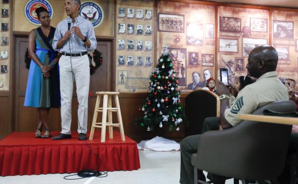 President Obama, joined by first lady Michelle Obama, thanks service members and their families at Marine Corps Base Hawaii, in Kaneohe Bay, Christmas Day. President Obama, joined by first lady Michelle Obama, thanks service members and their families at Marine Corps Base Hawaii, in Kaneohe Bay, Christmas Day.