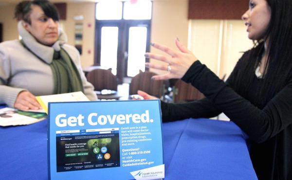 In New Jersey in March, Dianna Lopez of the Center for Family Services (right) speaks with Betsy Cruz, of Camden, N.J., about health insurance coverage during an Affordable Care Act information session. In New Jersey in March, Dianna Lopez of the Center for Family Services (right) speaks with Betsy Cruz, of Camden, N.J., about health insurance coverage during an Affordable Care Act information session.