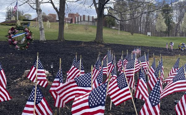 Flags and wreaths honor veterans on April 28, on the grounds of the Soldiers' Home in Holyoke, Mass., where a number of people died due to the coronavirus. While the death toll at the state-run Holyoke Soldiers' Home continues to climb, federal officials Flags and wreaths honor veterans on April 28, on the grounds of the Soldiers' Home in Holyoke, Mass., where a number of people died due to the coronavirus. While the death toll at the state-run Holyoke Soldiers' Home continues to climb, federal officials