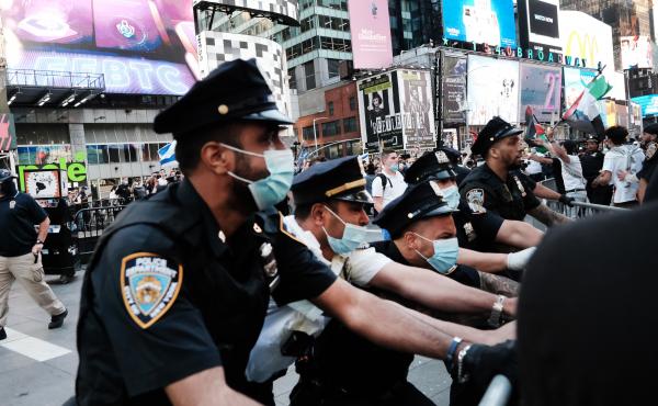 Pro-Palestinian protesters face off with Israel supporters and police last week in Times Square in New York City. Pro-Palestinian protesters face off with Israel supporters and police last week in Times Square in New York City.