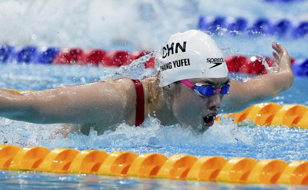 Zhang Yufei of China swims toward an Olympic record and gold medal in the women's 200-meter butterfly final at the Tokyo Olympics. Zhang Yufei of China swims toward an Olympic record and gold medal in the women's 200-meter butterfly final at the Tokyo Olympics.
