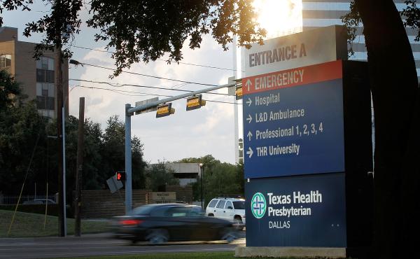 Traffic moves past Texas Health Presbyterian Hospital in Dallas, where a patient showed up with symptoms that were later confirmed to be Ebola. Traffic moves past Texas Health Presbyterian Hospital in Dallas, where a patient showed up with symptoms that were later confirmed to be Ebola.