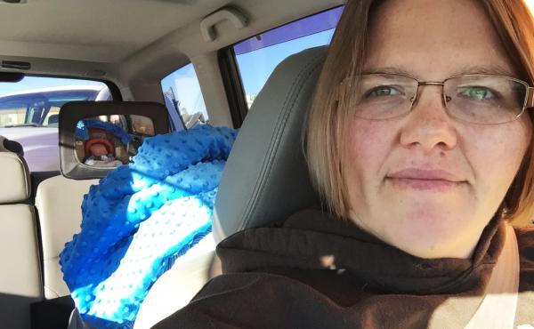 Tricia Olson takes a selfie of herself and her son Augustus, or Gus, who sits in his car seat. Olson took three weeks of unpaid leave from her job at a towing company in Rock Springs, Wyo., after giving birth. Tricia Olson takes a selfie of herself and her son Augustus, or Gus, who sits in his car seat. Olson took three weeks of unpaid leave from her job at a towing company in Rock Springs, Wyo., after giving birth.