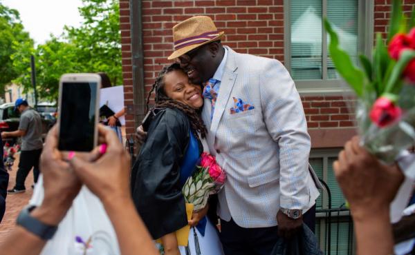 Rashema Melson gets a hug and has her photo taken with her cousin Anthony Young after the 2019 Georgetown University graduation ceremony. Rashema Melson gets a hug and has her photo taken with her cousin Anthony Young after the 2019 Georgetown University graduation ceremony.