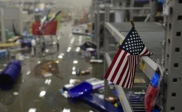 A flag drapes across looted shelves in a hardware store during widespread unrest following the death of George Floyd on May 31, 2020 in Philadelphia, Penn. A flag drapes across looted shelves in a hardware store during widespread unrest following the death of George Floyd on May 31, 2020 in Philadelphia, Penn.