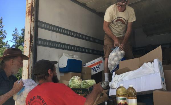 Jeff England, director of the Trinity County Food Bank, delivers items in remote Zenia, Calif. The closest large grocery store is 100 miles away. Jeff England, director of the Trinity County Food Bank, delivers items in remote Zenia, Calif. The closest large grocery store is 100 miles away.