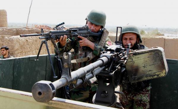 Afghan soldiers fight Taliban militants in Kunduz province, Afghanistan, on Sept. 21. Afghan soldiers fight Taliban militants in Kunduz province, Afghanistan, on Sept. 21.