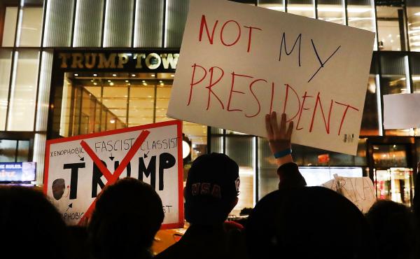 NEW YORK, NY - NOVEMBER 10: Dozens of anti-Donald Trump protesters stand along 5th Avenue in front of Trump Tower as New Yorkers react for a second night to the election of Trump as president of the United States on November 10, 2016 in New York City. Tru NEW YORK, NY - NOVEMBER 10: Dozens of anti-Donald Trump protesters stand along 5th Avenue in front of Trump Tower as New Yorkers react for a second night to the election of Trump as president of the United States on November 10, 2016 in New York City. Tru