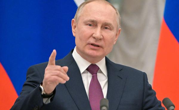 Russian President Vladimir Putin speaks during a joint news conference with Germany's chancellor following their meeting at the Kremlin, in Moscow, on Tuesday. That day the Kremlin said it pulled back some Russian troops but the U.S. and NATO have rejecte Russian President Vladimir Putin speaks during a joint news conference with Germany's chancellor following their meeting at the Kremlin, in Moscow, on Tuesday. That day the Kremlin said it pulled back some Russian troops but the U.S. and NATO have rejecte
