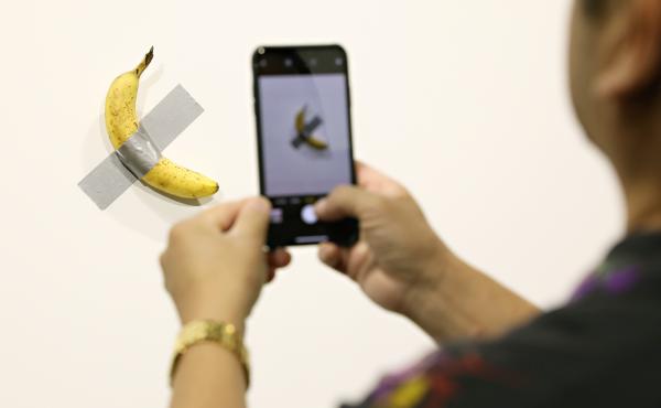 Two editions of Maurizio Cattelan's Comedian, a banana duct-taped to a wall, have reportedly sold for more than $100,000. Two editions of Maurizio Cattelan's Comedian, a banana duct-taped to a wall, have reportedly sold for more than $100,000.