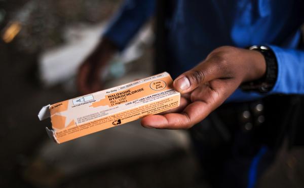 A Philadelphia police officer holds a package of the overdose antidote naloxone while on patrol in the Kensington neighborhood of Philadelphia in April 2017. A Philadelphia police officer holds a package of the overdose antidote naloxone while on patrol in the Kensington neighborhood of Philadelphia in April 2017.