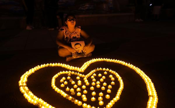 Nine-year-old Gabriella Santamaria holds up a picture of her uncle Stephen who died from a heroin overdose during a 2017 candlelight vigil for victims of drug addiction in Staten Island. Nine-year-old Gabriella Santamaria holds up a picture of her uncle Stephen who died from a heroin overdose during a 2017 candlelight vigil for victims of drug addiction in Staten Island.