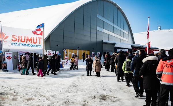 Voters stand in line to cast ballots Tuesday for Greenland's parliamentary elections at a polling station in the capital. Voters stand in line to cast ballots Tuesday for Greenland's parliamentary elections at a polling station in the capital.
