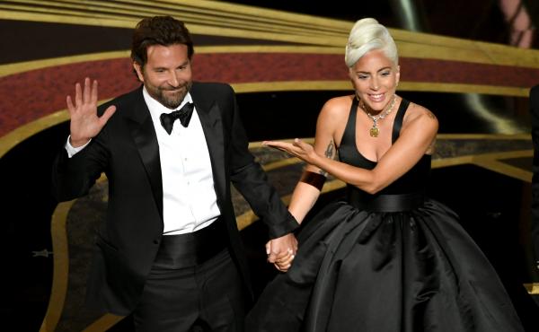 Bradley Cooper and Lady Gaga address the crowd after performing onstage at the Academy Awards. Their song "Shallow" later won the Oscar for original song. Bradley Cooper and Lady Gaga address the crowd after performing onstage at the Academy Awards. Their song "Shallow" later won the Oscar for original song.