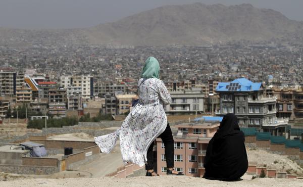 Afghan women look at the skyline of Kabul in September. Afghan women look at the skyline of Kabul in September.