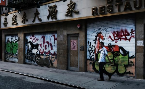 A man passes by a closed restaurant in New York City's Chinatown on Aug. 10, 2020. The unemployment rate for Asian Americans has surged amid the pandemic, a trend that has been overlooked amid the widespread economic misery. A man passes by a closed restaurant in New York City's Chinatown on Aug. 10, 2020. The unemployment rate for Asian Americans has surged amid the pandemic, a trend that has been overlooked amid the widespread economic misery.