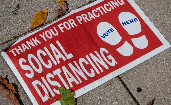 A social distancing sign on the ground. "Social distancing" was one of dozens of terms highlighted by researchers in Oxford Languages' 2020 Word of the Year campaign. A social distancing sign on the ground. "Social distancing" was one of dozens of terms highlighted by researchers in Oxford Languages' 2020 Word of the Year campaign.