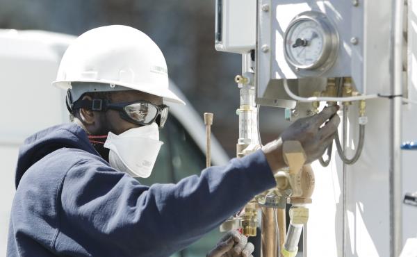 A technician adjusts the oxygen tanks for medical use at a Columbia University field hospital in April of 2020. The surging waves of cases of COVID-19 around the U.S. have led to shifting surges in demand by hospitals for extra oxygen. A technician adjusts the oxygen tanks for medical use at a Columbia University field hospital in April of 2020. The surging waves of cases of COVID-19 around the U.S. have led to shifting surges in demand by hospitals for extra oxygen.