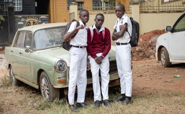 Kusemererwa Jonathan Henry, Joel Joseph (left and middle) and a friend pose for a photo on their way home from school. During the lockdown, they missed spending time in school together and would walk to visit each other. Kusemererwa Jonathan Henry, Joel Joseph (left and middle) and a friend pose for a photo on their way home from school. During the lockdown, they missed spending time in school together and would walk to visit each other.