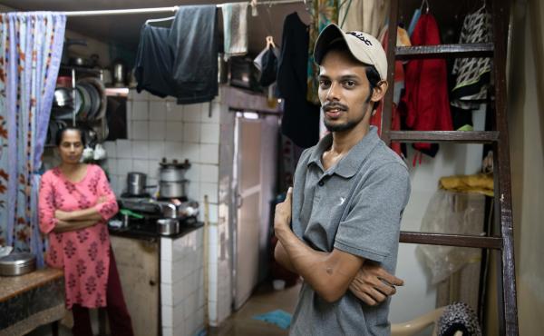 Salman Khan Rashid, 24, right, and his mother, Sana Rashid, at home. Salman lost his job as a golf coach at a Mumbai sports club during the pandemic. The household, which includes Salman's three sisters, is now surviving on savings. But when he's able, he Salman Khan Rashid, 24, right, and his mother, Sana Rashid, at home. Salman lost his job as a golf coach at a Mumbai sports club during the pandemic. The household, which includes Salman's three sisters, is now surviving on savings. But when he's able, he