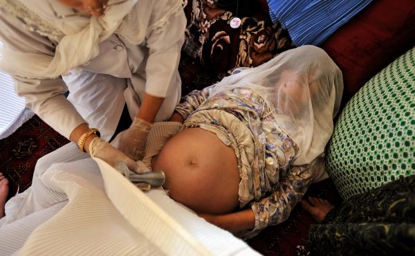 Addario's coverage of maternal mortality took her to a remote village in Badakhshan province, Afghanistan in 2009, where she photographed a midwife giving a prenatal check in a private home. "In these areas someone will announce that a doctor and a midwif Addario's coverage of maternal mortality took her to a remote village in Badakhshan province, Afghanistan in 2009, where she photographed a midwife giving a prenatal check in a private home. "In these areas someone will announce that a doctor and a midwif