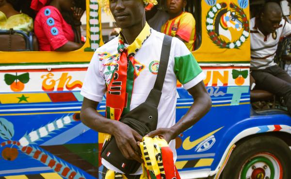 Before the World Cup began, Mousa Faye sold his "Allez Les Lions" (French for "go Lions") scarves for $1.25. Now they're going for $4.40. Before the World Cup began, Mousa Faye sold his "Allez Les Lions" (French for "go Lions") scarves for $1.25. Now they're going for $4.40.