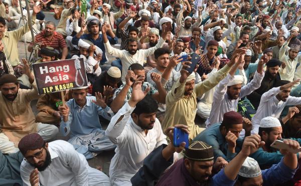 Supporters of Tehreek-e-Labaik Pakistan (TLP), a hard-line religious political party, chant slogans during a protest on Wednesday against the court decision to overturn the conviction of Asia Bibi. Supporters of Tehreek-e-Labaik Pakistan (TLP), a hard-line religious political party, chant slogans during a protest on Wednesday against the court decision to overturn the conviction of Asia Bibi.