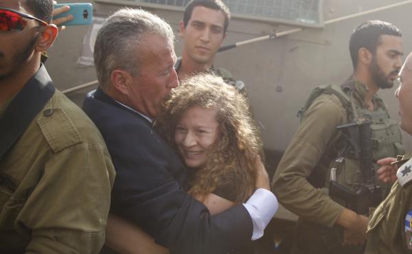 Ahed Tamimi hugs her father Bassem after she was released from an Israeli prison Sunday after serving an eight month sentence. Ahed Tamimi hugs her father Bassem after she was released from an Israeli prison Sunday after serving an eight month sentence.