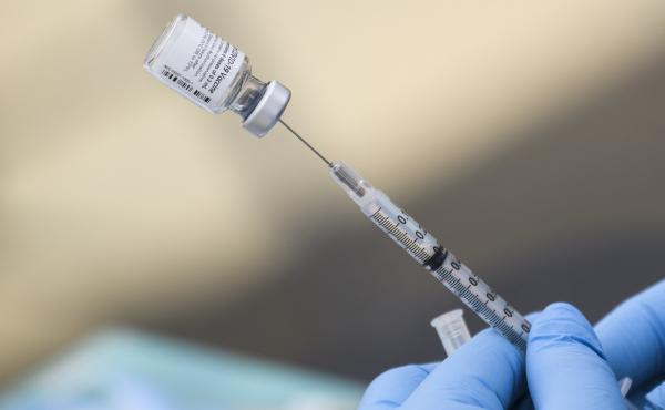 A syringe is filled with a dose of the Pfizer-BioNTech COVID-19 vaccine. While the vaccine has now been authorized for children between ages 5 and 11, it may take several weeks for shots to become widely available. A syringe is filled with a dose of the Pfizer-BioNTech COVID-19 vaccine. While the vaccine has now been authorized for children between ages 5 and 11, it may take several weeks for shots to become widely available.