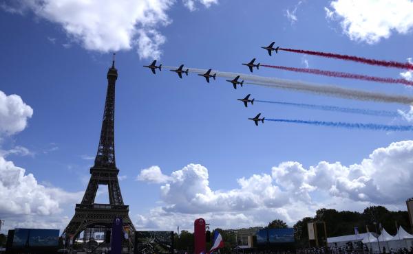 The French Aerial Patrol fly by the Eiffel Tower in Paris as part of the handover ceremony of Tokyo 2020 to Paris 2024, as Paris will be the next Summer Games host in 2024. The French Aerial Patrol fly by the Eiffel Tower in Paris as part of the handover ceremony of Tokyo 2020 to Paris 2024, as Paris will be the next Summer Games host in 2024.
