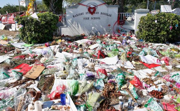 A general view of the makeshift memorial in front of Marjory Stoneman Douglas High School in Parkland, Florida on March 14, 2018. / AFP PHOTO / RHONA WISE (Photo credit should read RHONA WISE/AFP/Getty Images) A general view of the makeshift memorial in front of Marjory Stoneman Douglas High School in Parkland, Florida on March 14, 2018. / AFP PHOTO / RHONA WISE (Photo credit should read RHONA WISE/AFP/Getty Images)