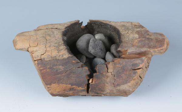 Scientists exhumed 10 wooden braziers from eight tombs at the ancient Jirzankal Cemetery in what is now western China. Many of the braziers held stones that were apparently heated and used to burn cannabis plants. Scientists exhumed 10 wooden braziers from eight tombs at the ancient Jirzankal Cemetery in what is now western China. Many of the braziers held stones that were apparently heated and used to burn cannabis plants.