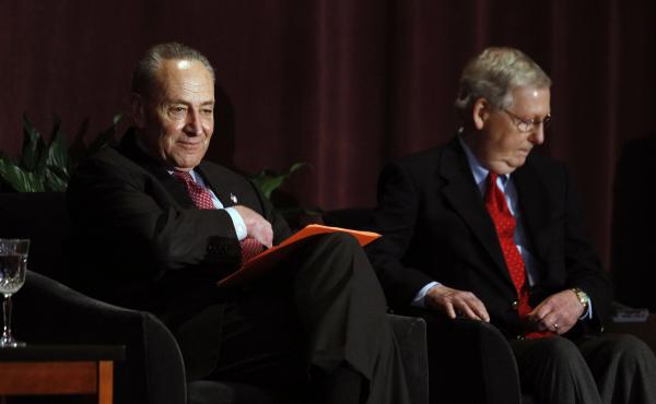 Senate Majority Leader Mitch McConnell, right, and Senate Minority Leader Chuck Schumer wait on stage together at the University of Louisville's McConnell Center before Schumer's scheduled speech last year. Senate Majority Leader Mitch McConnell, right, and Senate Minority Leader Chuck Schumer wait on stage together at the University of Louisville's McConnell Center before Schumer's scheduled speech last year.