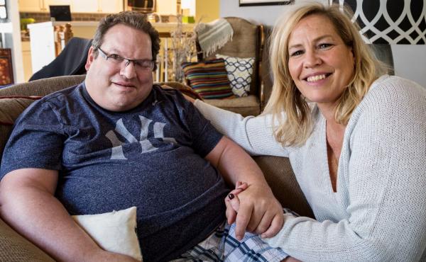 Neal Siegel, who lives with his girlfriend, Beth Wargo, is one of six disabled Iowans suing the state over its privatized Medicaid program. Neal Siegel, who lives with his girlfriend, Beth Wargo, is one of six disabled Iowans suing the state over its privatized Medicaid program.