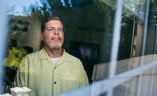 Tom Murphy, 56, in his home in Gainesville, Va., was diagnosed with ALS four years ago. An experimental drug seems to have slowed the progression of his disease, he says, though most ALS patients aren't as lucky. Tom Murphy, 56, in his home in Gainesville, Va., was diagnosed with ALS four years ago. An experimental drug seems to have slowed the progression of his disease, he says, though most ALS patients aren't as lucky.