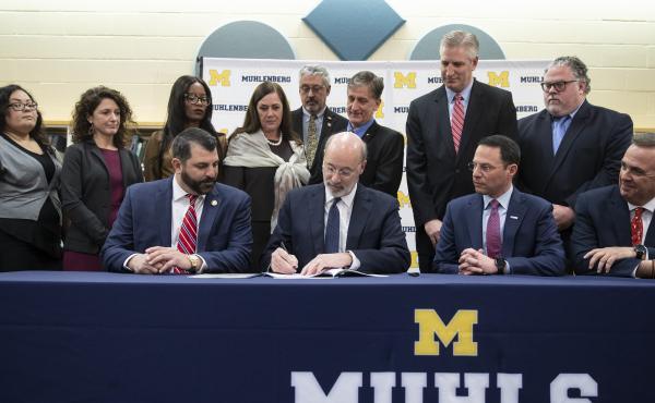 Pennsylvania Gov. Tom Wolf, center, signs legislation overhauling the state's child sex abuse laws. Pennsylvania Gov. Tom Wolf, center, signs legislation overhauling the state's child sex abuse laws.
