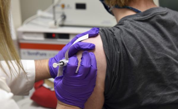 The first patient enrolled in Pfizer's COVID-19 vaccine clinical trial at the University of Maryland School of Medicine in Baltimore receives an injection in May. The first patient enrolled in Pfizer's COVID-19 vaccine clinical trial at the University of Maryland School of Medicine in Baltimore receives an injection in May.