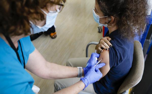 A teen gets a dose of Pfizer's COVID-19 vaccine last month at Holtz Children's Hospital in Miami. Nearly 7 million U.S. teens and preteens (ages 12 through 17) have received at least one dose of a COVID-19 vaccine so far, the CDC says. A teen gets a dose of Pfizer's COVID-19 vaccine last month at Holtz Children's Hospital in Miami. Nearly 7 million U.S. teens and preteens (ages 12 through 17) have received at least one dose of a COVID-19 vaccine so far, the CDC says.