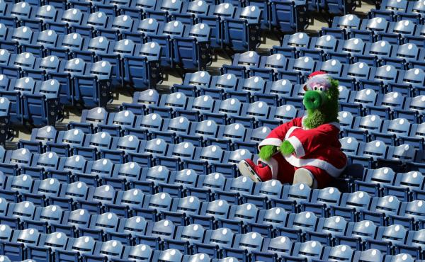 The Phillie Phanatic sits alone in the stands during a game between the Miami Marlins and the Philadelphia Phillies on Saturday. During this series, as many as 19 Marlins players and coaches had already been infected with the coronavirus. The Phillie Phanatic sits alone in the stands during a game between the Miami Marlins and the Philadelphia Phillies on Saturday. During this series, as many as 19 Marlins players and coaches had already been infected with the coronavirus.