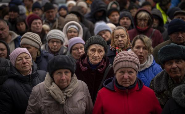 April 18: Ukrainians wait as Red Cross relief workers distribute food in Bucha, on the outskirts of Kyiv, Ukraine. April 18: Ukrainians wait as Red Cross relief workers distribute food in Bucha, on the outskirts of Kyiv, Ukraine.