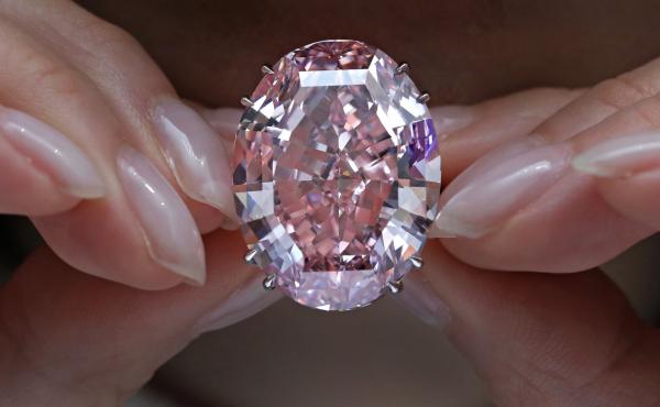 The Pink Star diamond, which fetched the highest price ever for a jewel offered at auction, is displayed at Sotheby's in Hong Kong on March 29. The Pink Star diamond, which fetched the highest price ever for a jewel offered at auction, is displayed at Sotheby's in Hong Kong on March 29.