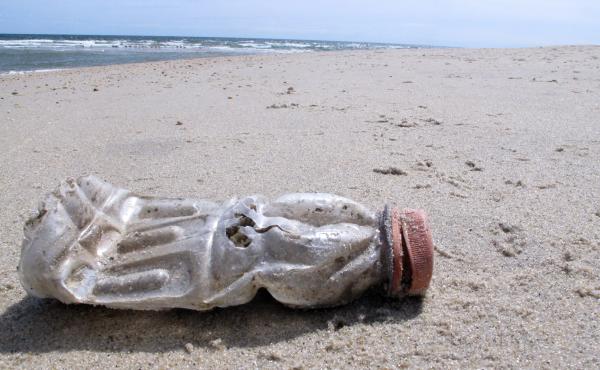 A discarded plastic bottle lies on the beach at Sandy Hook, N.J. Packaging is the largest source of the plastic waste that now blankets our planet. A discarded plastic bottle lies on the beach at Sandy Hook, N.J. Packaging is the largest source of the plastic waste that now blankets our planet.