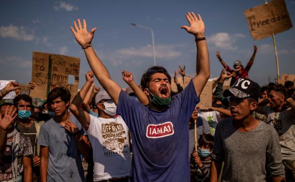 Refugees from the Moria camp protest near Mytilene on the Greek island of Lesbos on Saturday, a few days after a fire destroyed the refugee camp. Refugees from the Moria camp protest near Mytilene on the Greek island of Lesbos on Saturday, a few days after a fire destroyed the refugee camp.