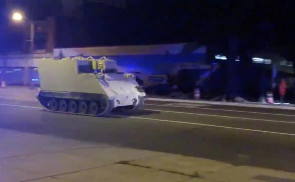 A stolen armored personnel carrier drives through Richmond, Va., on Tuesday. A stolen armored personnel carrier drives through Richmond, Va., on Tuesday.